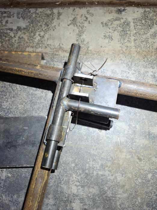 Steel riding arena with horses under shade